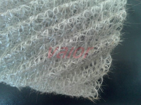 It is co-knitted mesh of one strand of metal wire and multifilament of glass fiber.