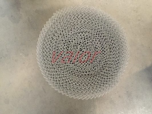 Rolled knit mesh demister pad.